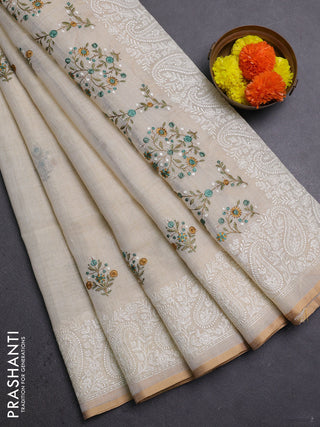 Off White & Teal Green Linen Saree - Embroidery
