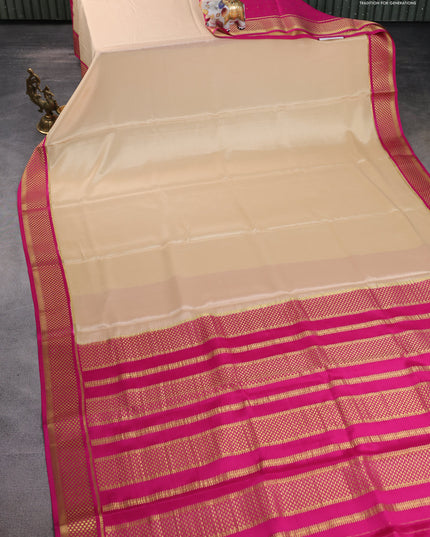 Pure mysore partly silk saree beige and pink with plain body and zari woven border