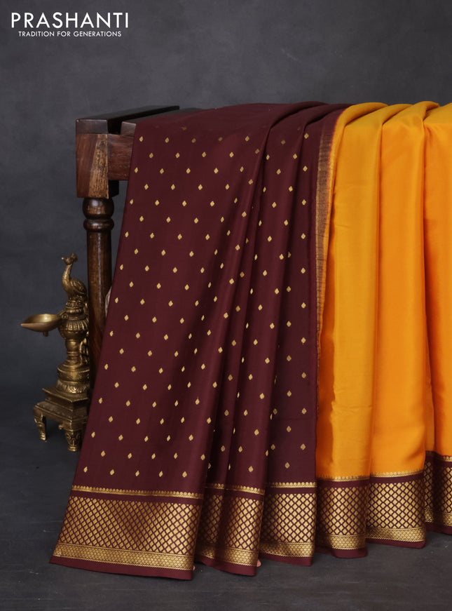 Pure mysore partly silk saree mustard yellow and brown with plain body and zari woven border