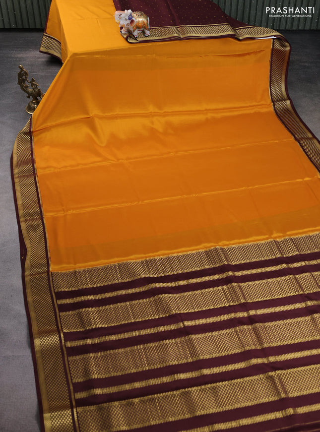 Pure mysore partly silk saree mustard yellow and brown with plain body and zari woven border