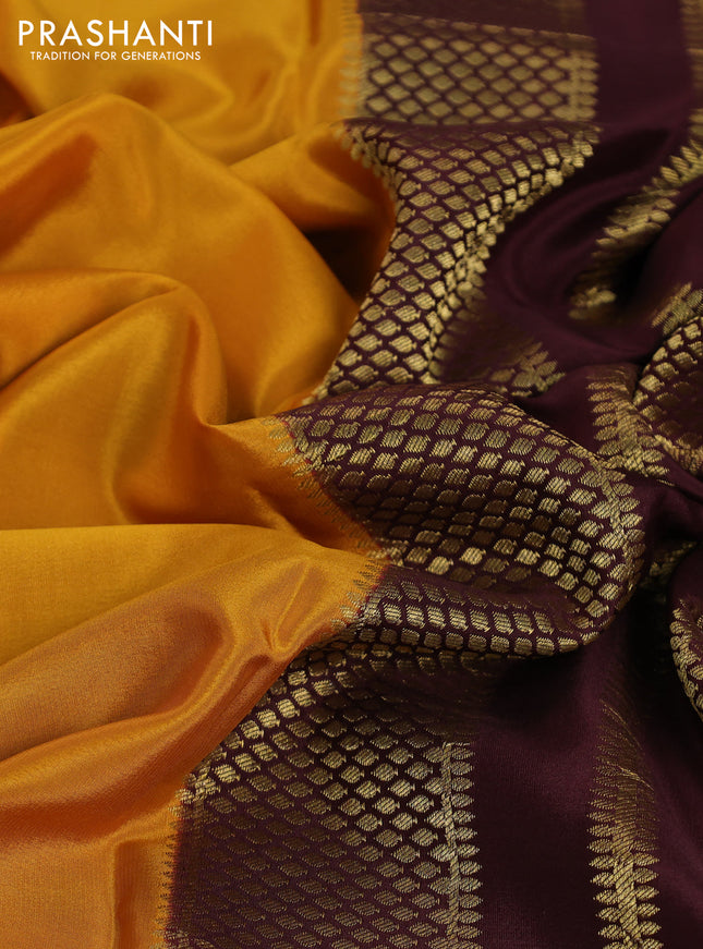 Pure mysore partly silk saree mustard yellow and brown with plain body and zari woven border