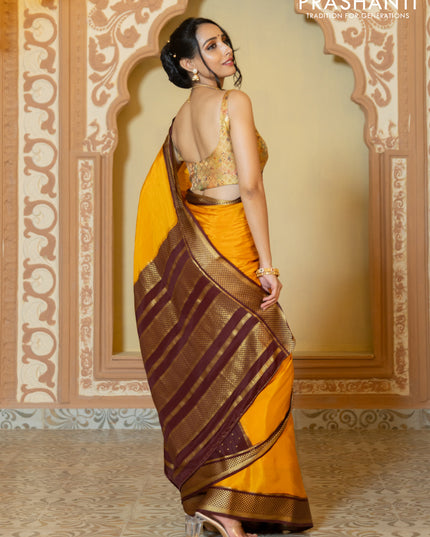 Pure mysore partly silk saree mustard yellow and brown with plain body and zari woven border