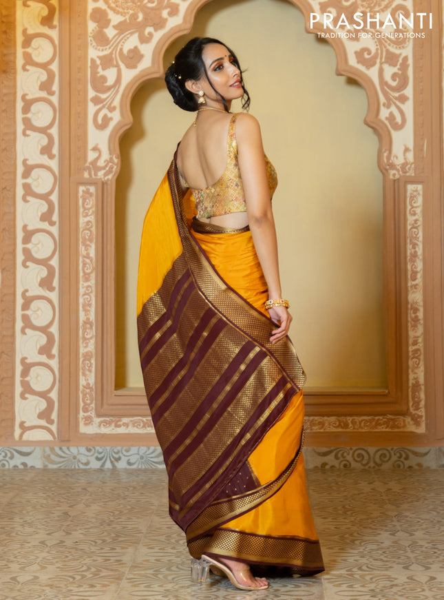 Pure mysore partly silk saree mustard yellow and brown with plain body and zari woven border