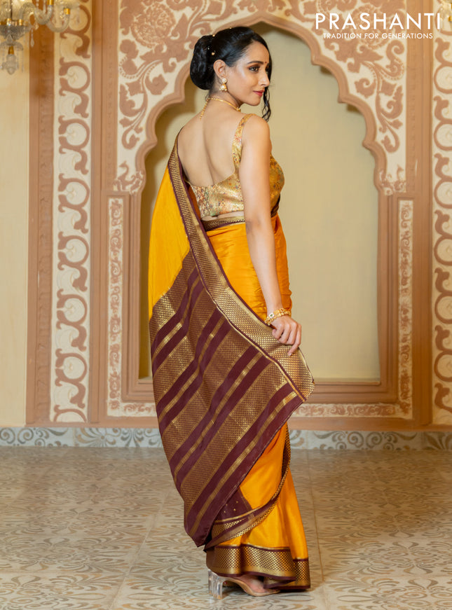 Pure mysore partly silk saree mustard yellow and brown with plain body and zari woven border