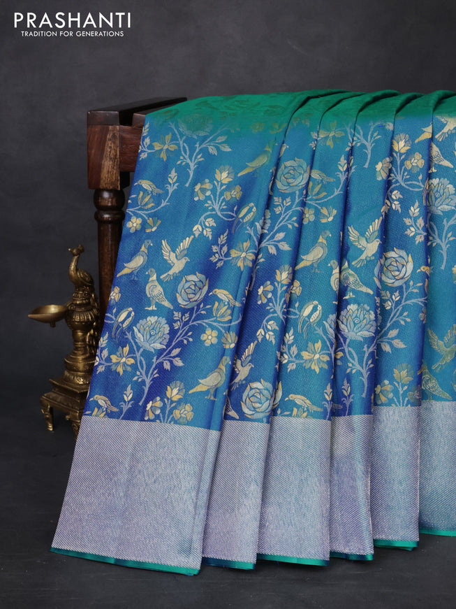 Pure kanchipuram silk saree dual shade of teal green with bird motif weaves and silver zari woven border