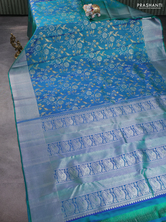 Pure kanchipuram silk saree dual shade of teal green with bird motif weaves and silver zari woven border