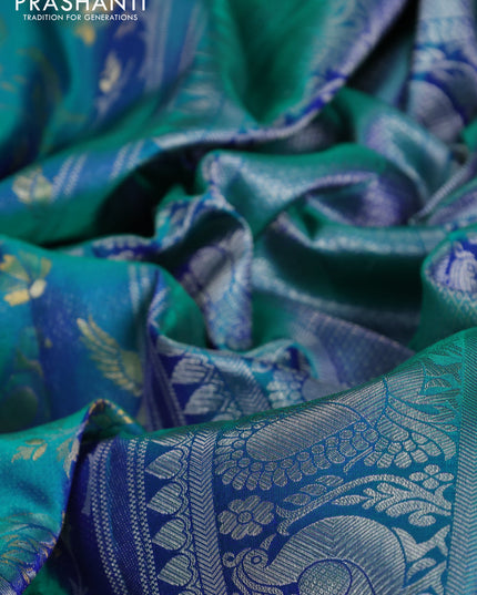 Pure kanchipuram silk saree dual shade of teal green with bird motif weaves and silver zari woven border