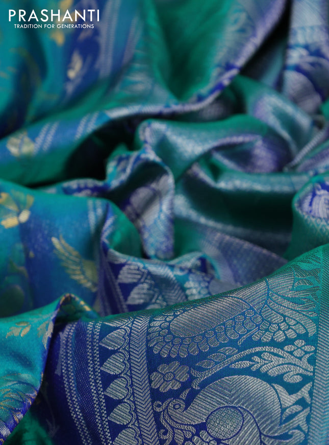 Pure kanchipuram silk saree dual shade of teal green with bird motif weaves and silver zari woven border