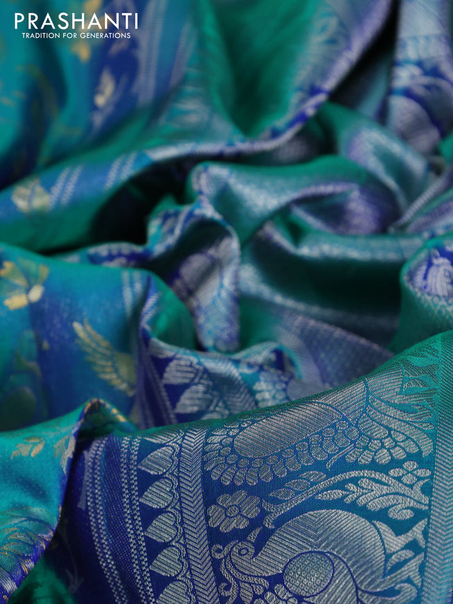 Pure kanchipuram silk saree dual shade of teal green with bird motif weaves and silver zari woven border