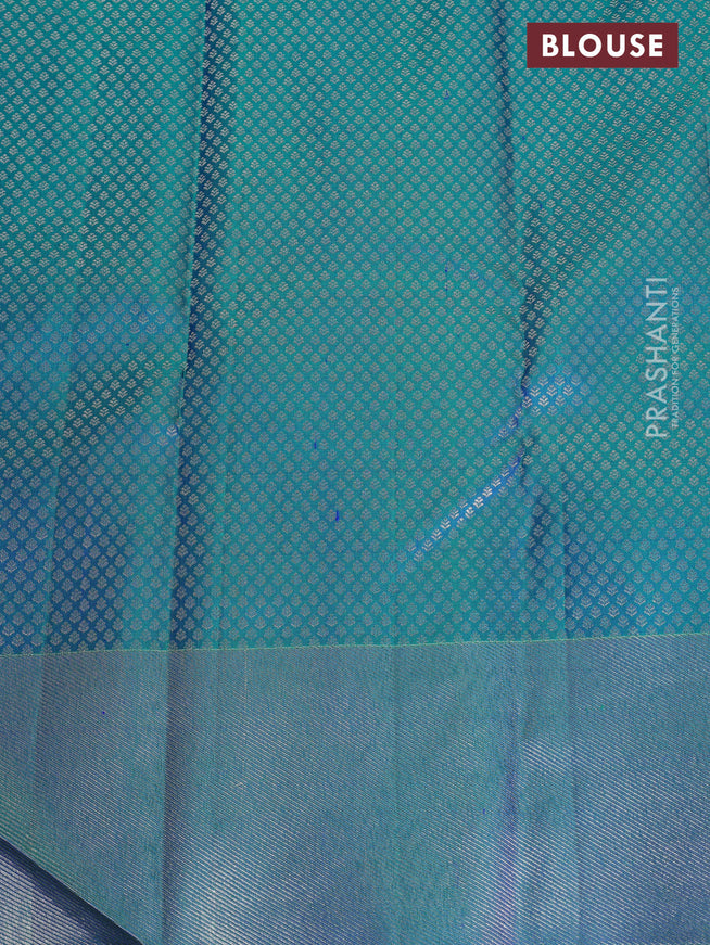 Pure kanchipuram silk saree dual shade of teal green with bird motif weaves and silver zari woven border