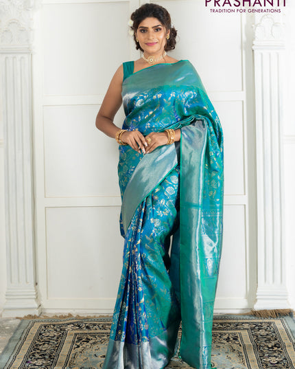 Pure kanchipuram silk saree dual shade of teal green with bird motif weaves and silver zari woven border