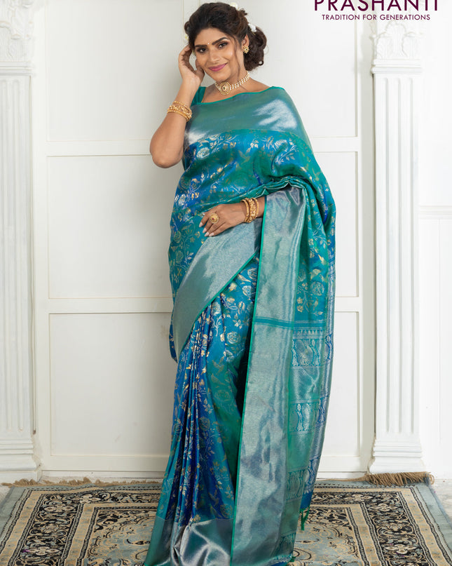 Pure kanchipuram silk saree dual shade of teal green with bird motif weaves and silver zari woven border