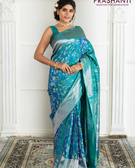 Pure kanchipuram silk saree dual shade of teal green with bird motif weaves and silver zari woven border