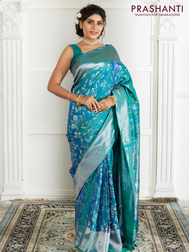 Pure kanchipuram silk saree dual shade of teal green with bird motif weaves and silver zari woven border