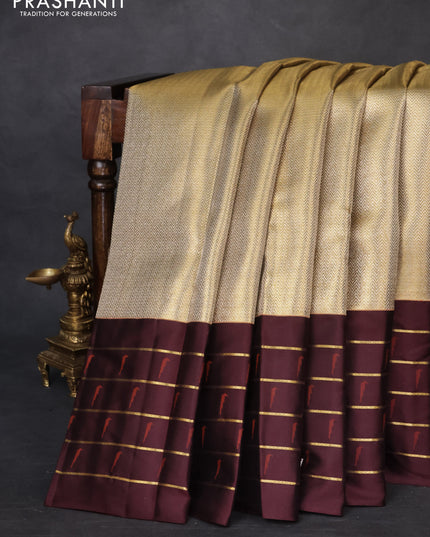 Pure kanchipuram tissue silk saree gold and deep maroon with allover zari woven brocade weaves and muniya butta zari woven border