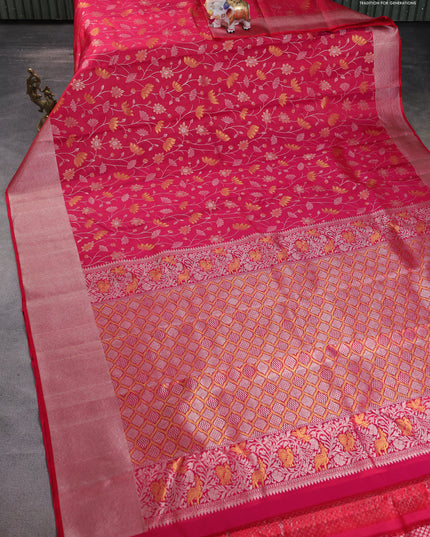Pure kanchipuram silk saree reddish pink with floral motif zari weaves and silver zari woven border