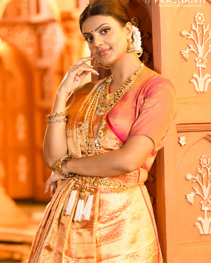 Pure kanchipuram tissue silk saree gold and pink with allover convent embroidery and temple design zari woven border