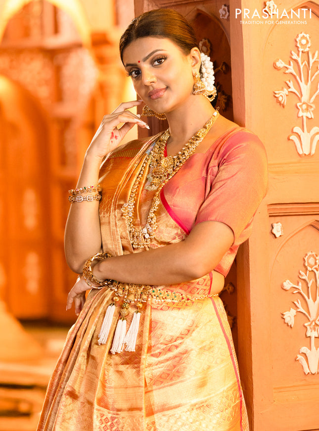 Pure kanchipuram tissue silk saree gold and pink with allover convent embroidery and temple design zari woven border