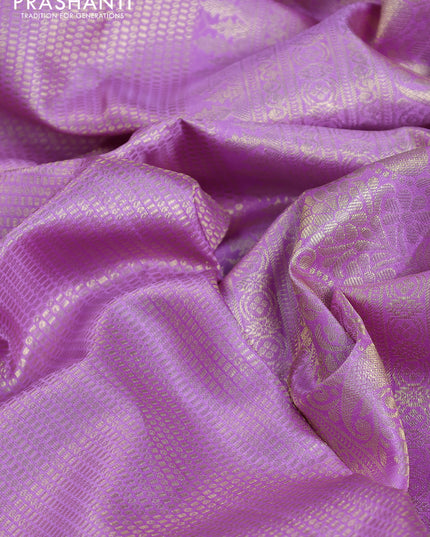 Pure kanchipuram silk saree lavender with allover zari woven brocade weaves and parrot design zari woven border