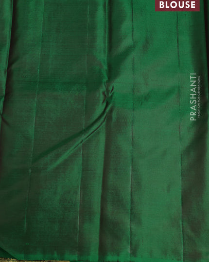 Pure kanchipuram silk saree dual shade of green with floral motifs and long rich zari wover korvai border