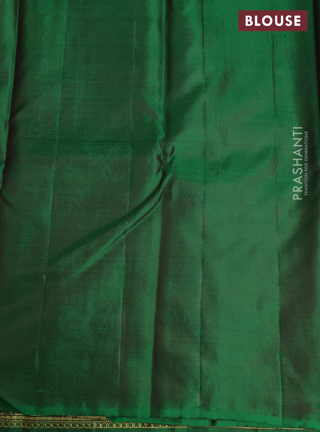 Pure kanchipuram silk saree dual shade of green with floral motifs and long rich zari wover korvai border