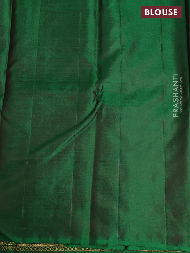 Pure kanchipuram silk saree dual shade of green with floral motifs and long rich zari wover korvai border