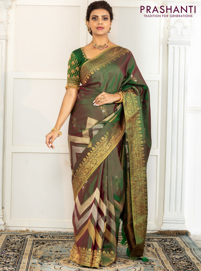 Pure kanchipuram silk saree dual shade of green with floral motifs and long rich zari wover korvai border