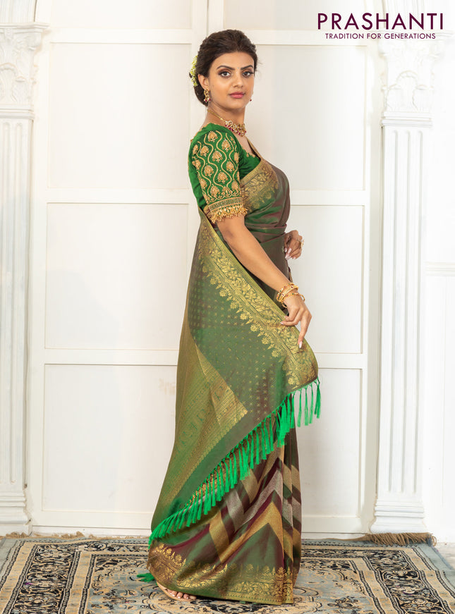 Pure kanchipuram silk saree dual shade of green with floral motifs and long rich zari wover korvai border