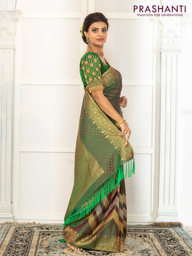Pure kanchipuram silk saree dual shade of green with floral motifs and long rich zari wover korvai border