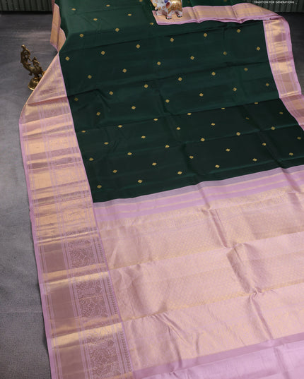 Pure kanchipuram silk saree bottle green and pastel pink with zari woven buttas and long rich zari wover korvai border