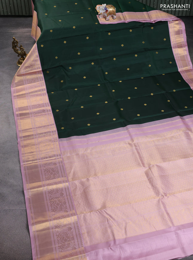 Pure kanchipuram silk saree bottle green and pastel pink with zari woven buttas and long rich zari wover korvai border