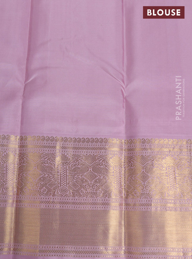Pure kanchipuram silk saree bottle green and pastel pink with zari woven buttas and long rich zari wover korvai border
