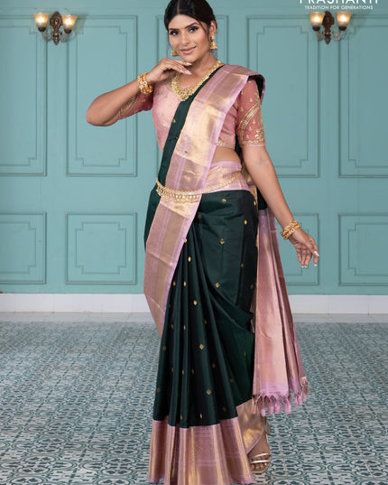 Pure kanchipuram silk saree bottle green and pastel pink with zari woven buttas and long rich zari wover korvai border