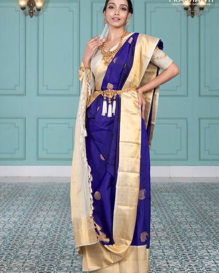 Pure kanchipuram silk saree blue and cream with elephnant zari woven buttas and rich zari woven korvai border