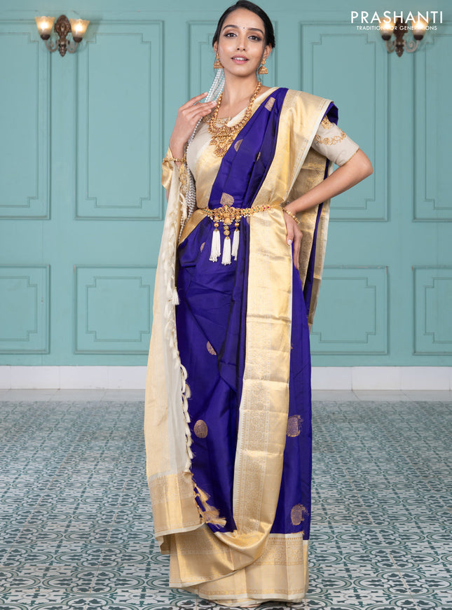 Pure kanchipuram silk saree blue and cream with elephnant zari woven buttas and rich zari woven korvai border
