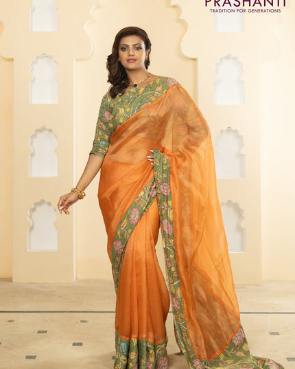Pure organza silk saree orange and pastel green with plain body and kalamkari printed pita work border