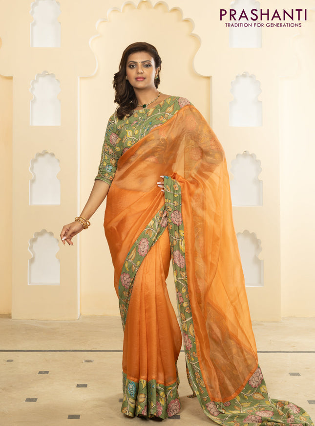 Pure organza silk saree orange and pastel green with plain body and kalamkari printed pita work border