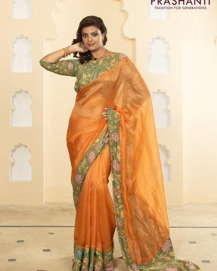 Pure organza silk saree orange and pastel green with plain body and kalamkari printed pita work border