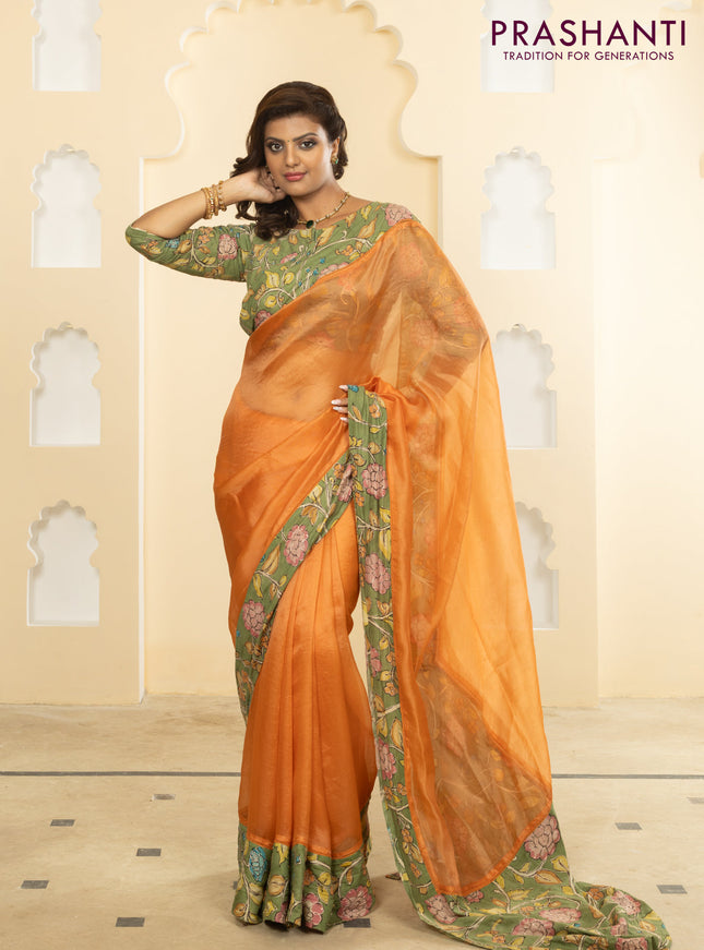 Pure organza silk saree orange and pastel green with plain body and kalamkari printed pita work border
