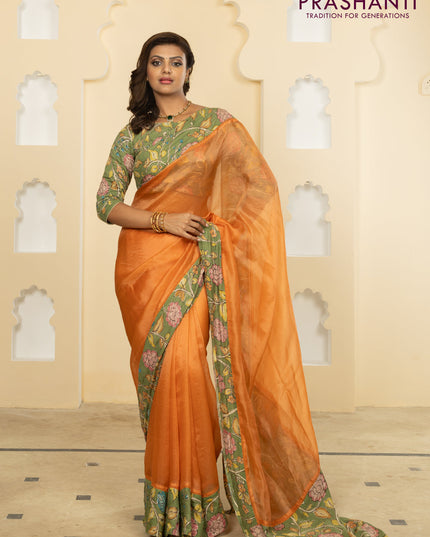 Pure organza silk saree orange and pastel green with plain body and kalamkari printed pita work border