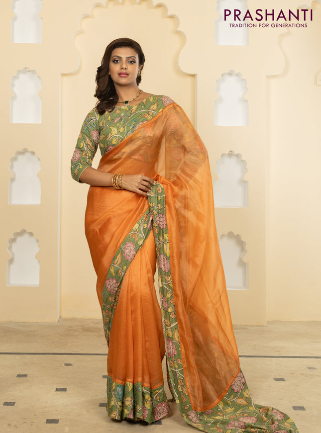 Pure organza silk saree orange and pastel green with plain body and kalamkari printed pita work border