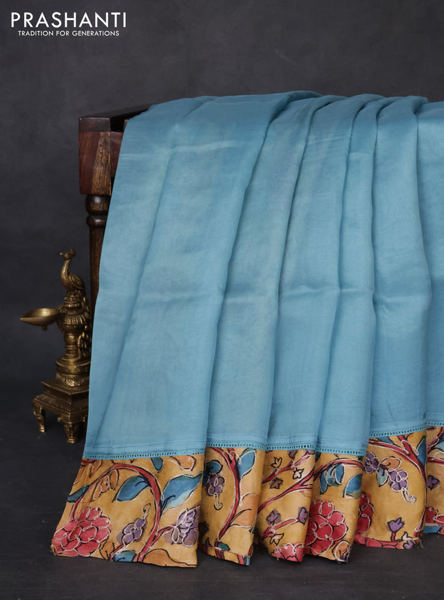 Pure organza silk saree pastel blue and sandal with plain body and kalamkari printed pita work border