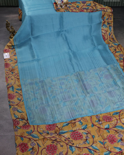 Pure organza silk saree pastel blue and sandal with plain body and kalamkari printed pita work border