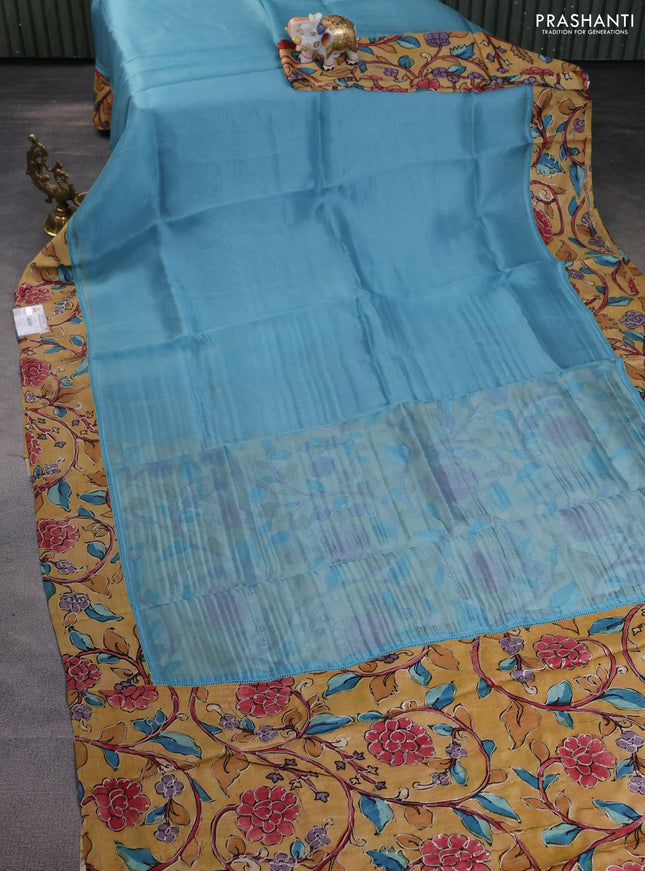 Pure organza silk saree pastel blue and sandal with plain body and kalamkari printed pita work border