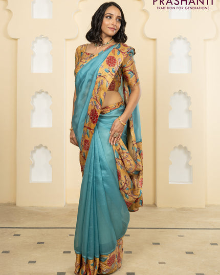 Pure organza silk saree pastel blue and sandal with plain body and kalamkari printed pita work border