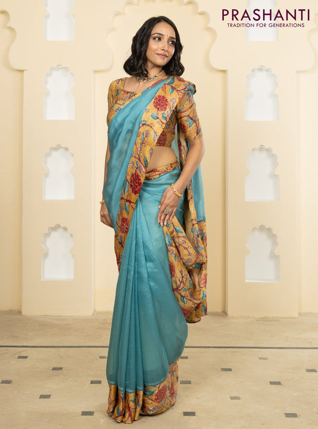 Pure organza silk saree pastel blue and sandal with plain body and kalamkari printed pita work border
