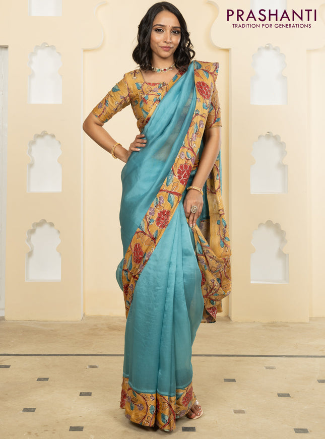 Pure organza silk saree pastel blue and sandal with plain body and kalamkari printed pita work border