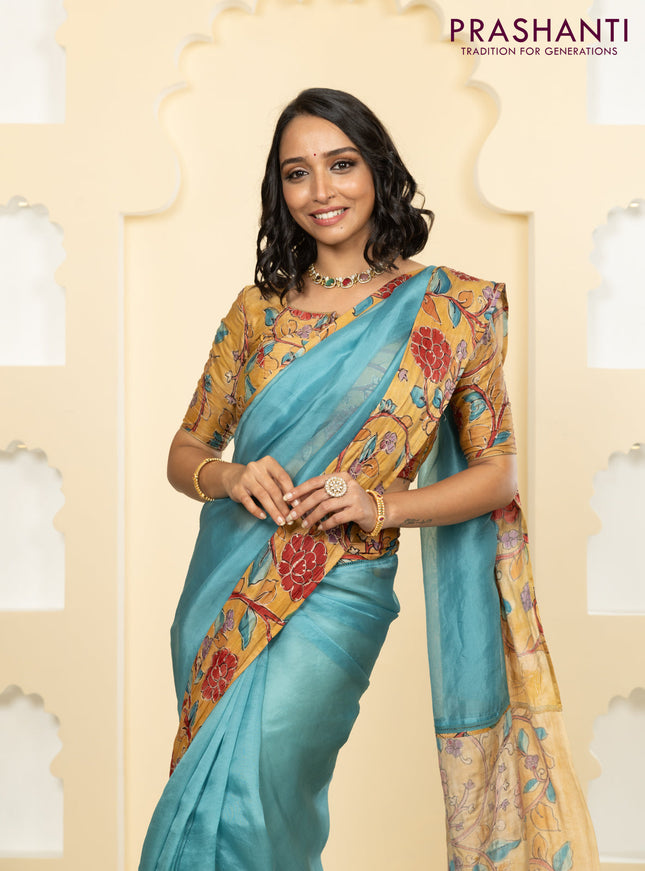 Pure organza silk saree pastel blue and sandal with plain body and kalamkari printed pita work border