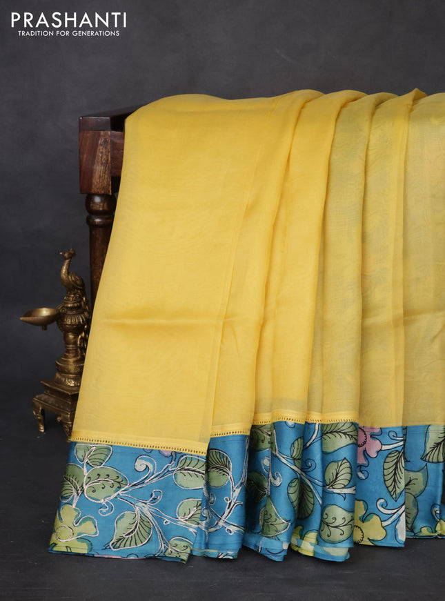 Pure organza silk saree yellow and cs blue with plain body and kalamkari printed pita work border