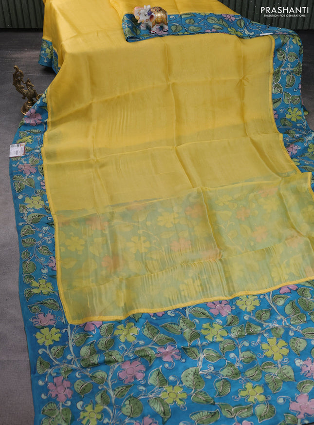 Pure organza silk saree yellow and cs blue with plain body and kalamkari printed pita work border